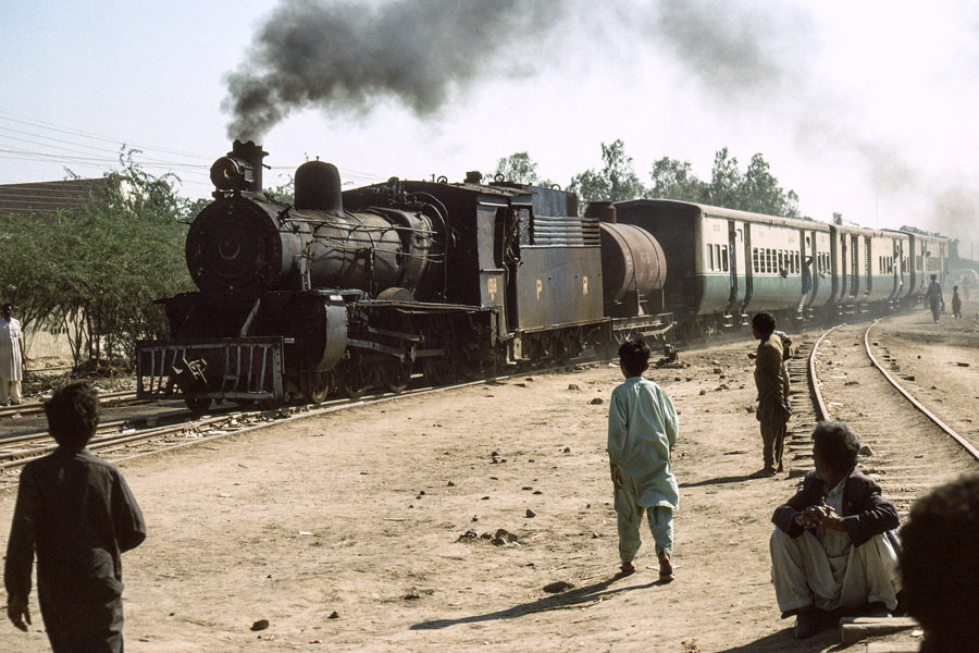 Oil fired, meter gauge, class SP 4-6-0 138 arrives at Jhudo, Pakistan, with a train from Mirpur Khas