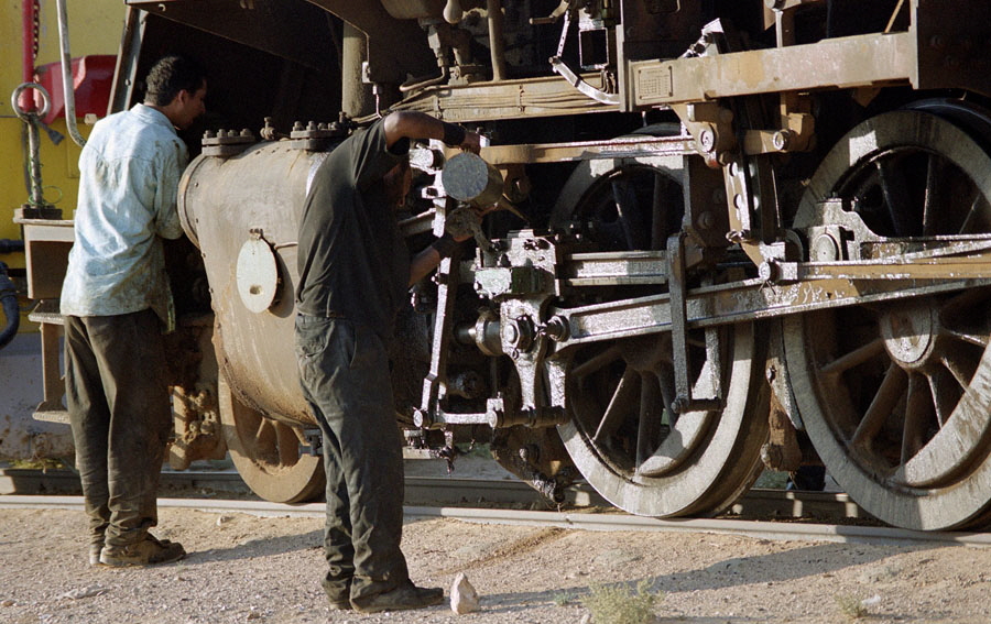 Routine maintenance of steam locomotive 51 in desert, Hedjaz Railway, Jordan