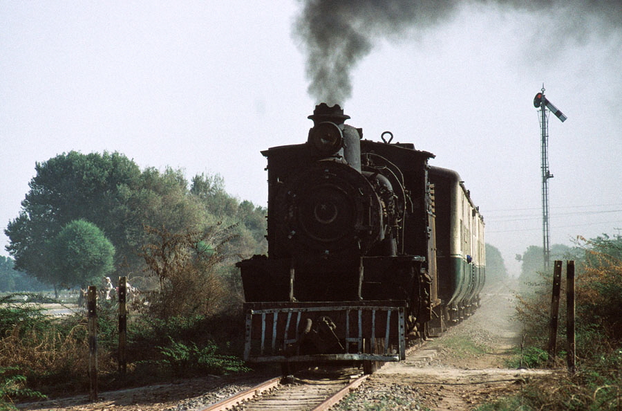 Oil fired, meter gauge, class SP 4-6-0 138 near Jhudo, Pakistan, with a train heading back to Mirpur Khas