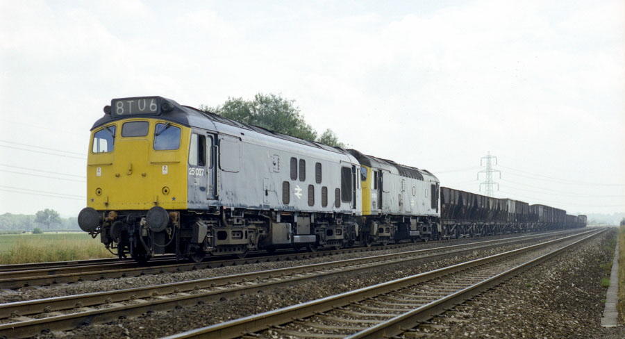 Class 25 Bo-Bo diesel locomotives nos.25037 & 25104 with a freight train heads north on the Midland Main Line south of Loughborough