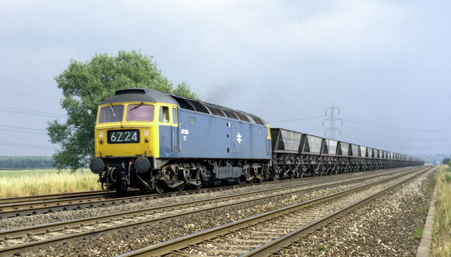 Class 47 Co-Co diesel locomotive no.47359 with "Merry Go Round" coal empties heads north on the Midland Main Line south of Loughborough