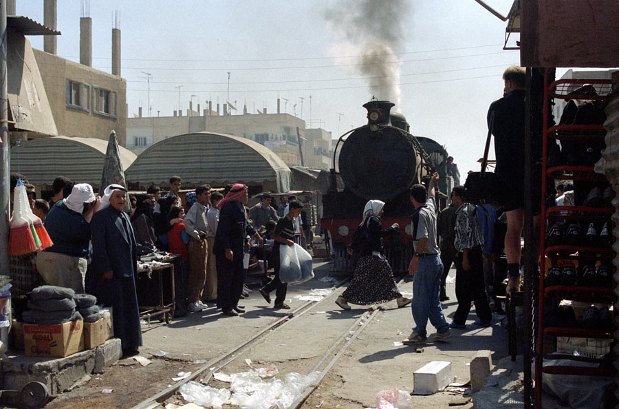 Steam train passing through market, Dera'a, Hedjaz Railway, Syria