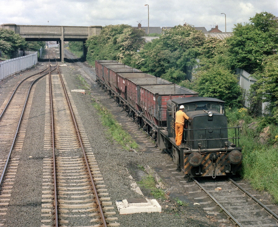 NCB 0-6-0 diesel locomotive propels a train of empty coal wagons up the incline from Seaham harbour to Seaham colliery